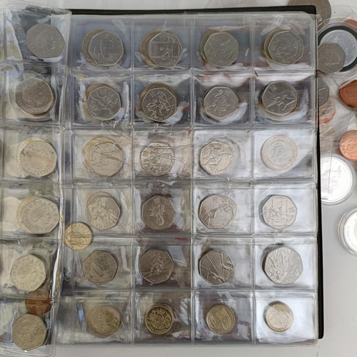 353 - A group of assorted modern commemorative £2, £1, 50p, other coins and crowns, in an albu...