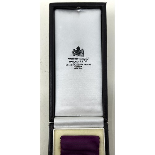 531 - An official Hancocks replica Victoria Cross, the reverse engraved 'Hancocks 256', cased, with paperw... 