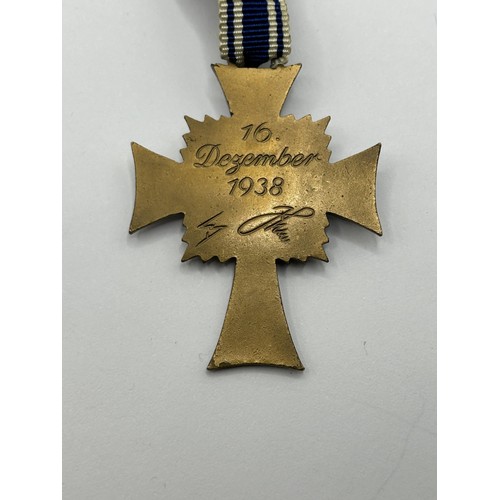 567 - A German Mother's Cross, and other items