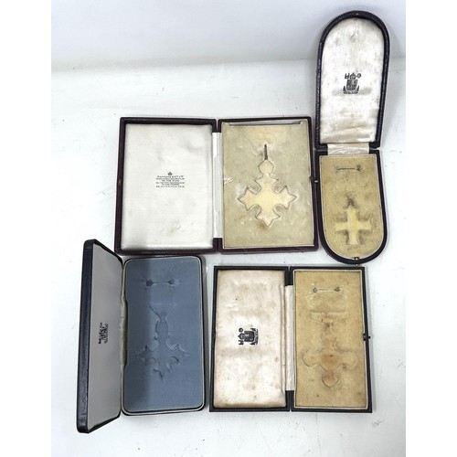 569 - Four medal boxes/cases for a CBE, DFC, MC, and an MBE (4) Provenance: On Instructions of the Family:... 