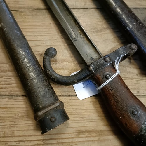 503 - Two French bayonets, 1878, with scabbards, and a Ross Rifle bayonet (3)