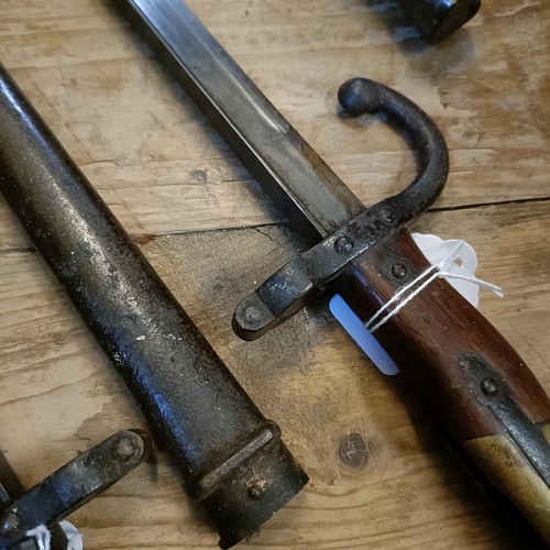 503 - Two French bayonets, 1878, with scabbards, and a Ross Rifle bayonet (3)