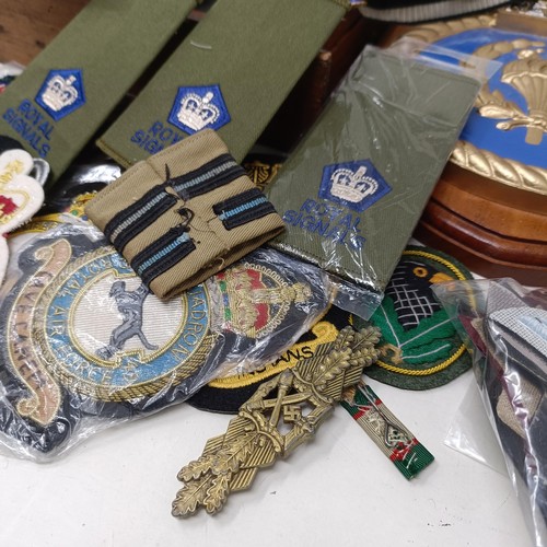 507 - A composition ship's crest, HMS Renown, various cloth badges, epaulettes, insignia and other items P... 