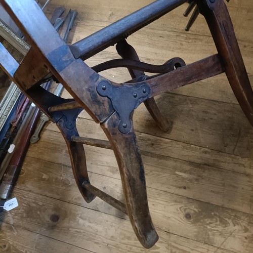 509 - A small stained beech campaign folding chair, stamped with an MOD crow's foot