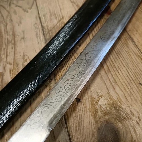 515 - A sabre, in a scabbard, 93 cm