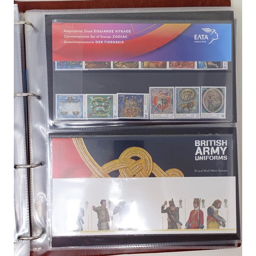 626 - Assorted Royal Mail presentation packs, in four albums