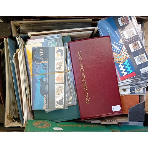 630 - A large group of world stamps, loose and in albums, and various presentation packs (4 boxes)