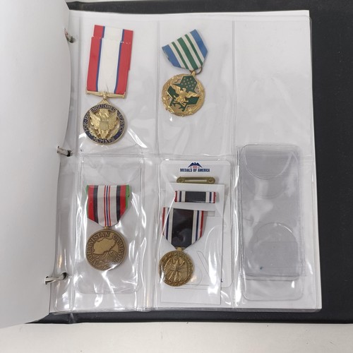 415 - A group of assorted American medals, in an album Provenance: On Instructions of the Family: Medals a... 