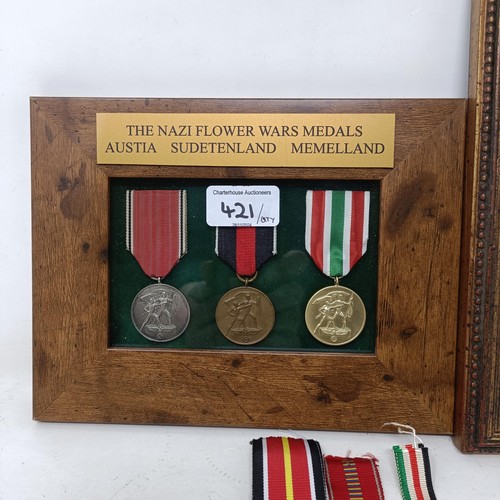 421 - A group of German medals, in two frames, and loose Provenance: On Instructions of the Family: Medals... 