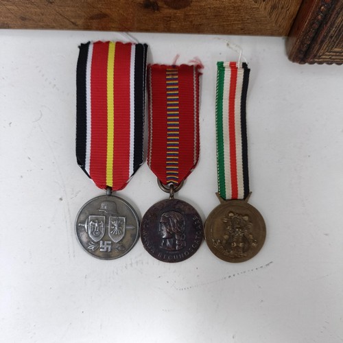 421 - A group of German medals, in two frames, and loose Provenance: On Instructions of the Family: Medals... 