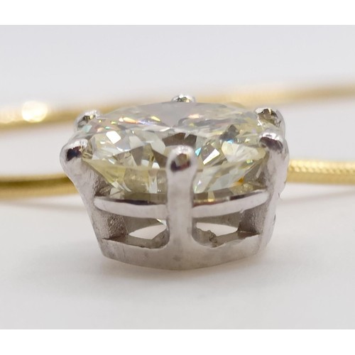 1602 - A 2ct diamond pendant, on an 18ct gold chain, with a white metal and diamond ring, which originally ... 