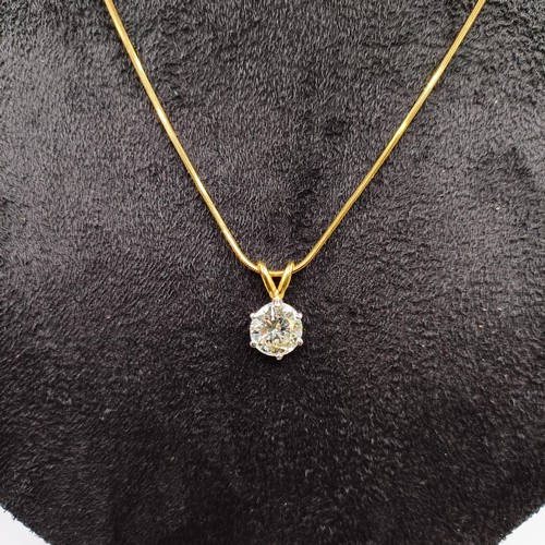 1602 - A 2ct diamond pendant, on an 18ct gold chain, with a white metal and diamond ring, which originally ... 