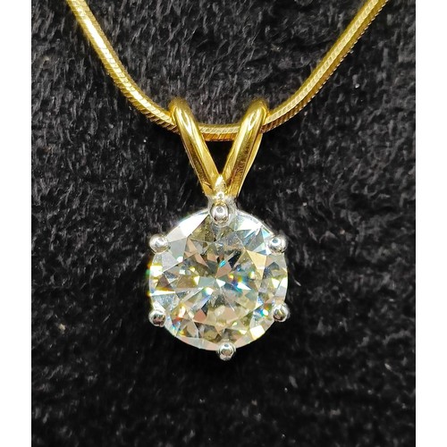 1602 - A 2ct diamond pendant, on an 18ct gold chain, with a white metal and diamond ring, which originally ... 