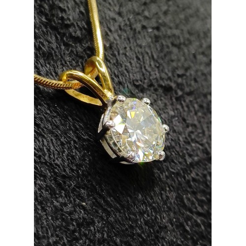 1602 - A 2ct diamond pendant, on an 18ct gold chain, with a white metal and diamond ring, which originally ... 