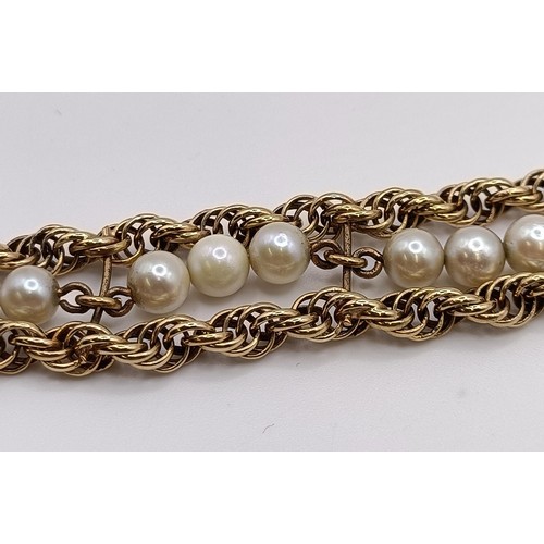 1606 - A yellow metal and cultured pearl bracelet