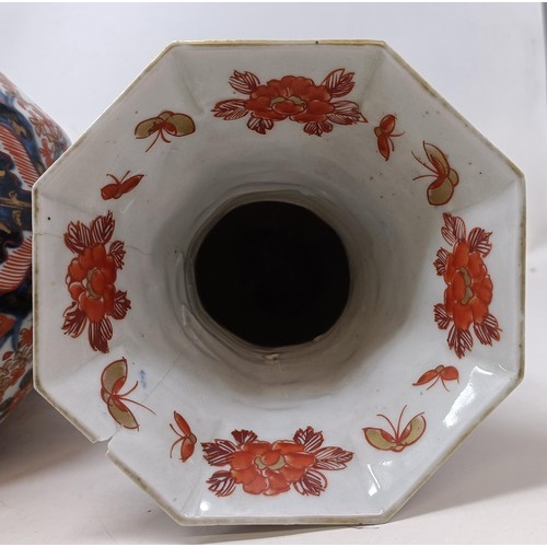 1057 - A pair of Japanese Imari vases, 22 cm high, and another similar, 23 cm high (3)