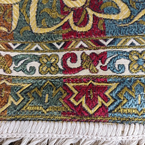 1058 - An Islamic shawl, decorated floral forms and script