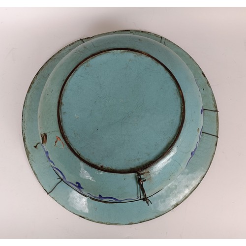 1065 - A Chinese enamel bowl, decorated flowers and butterflies, various losses, 42 cm diameter