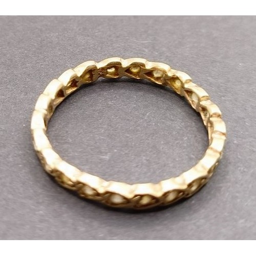 1628 - A yellow metal and white stone eternity ring, ring size S, and a white and yellow stone ring, inset ... 