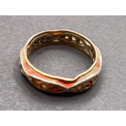 1628 - A yellow metal and white stone eternity ring, ring size S, and a white and yellow stone ring, inset ... 