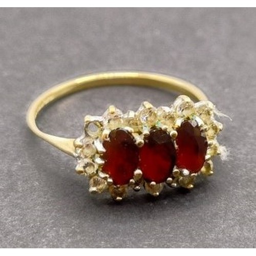 1634 - A yellow metal, red and white stone dress ring, ring size T, and another, ring size T (2)