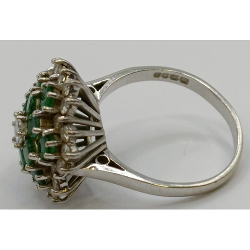 1657 - An 18ct white gold, emerald and diamond cluster ring, ring size M