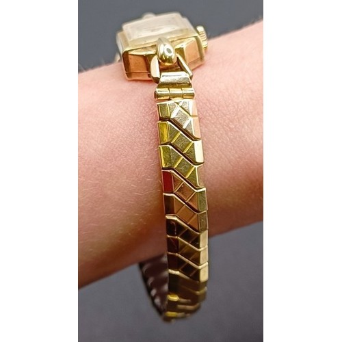 1672 - A ladies 9ct gold Rotary wristwatch, on a gold plated expandable strap