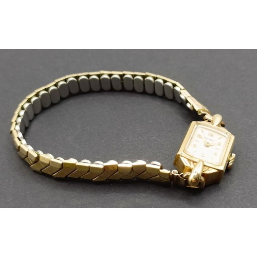 1672 - A ladies 9ct gold Rotary wristwatch, on a gold plated expandable strap