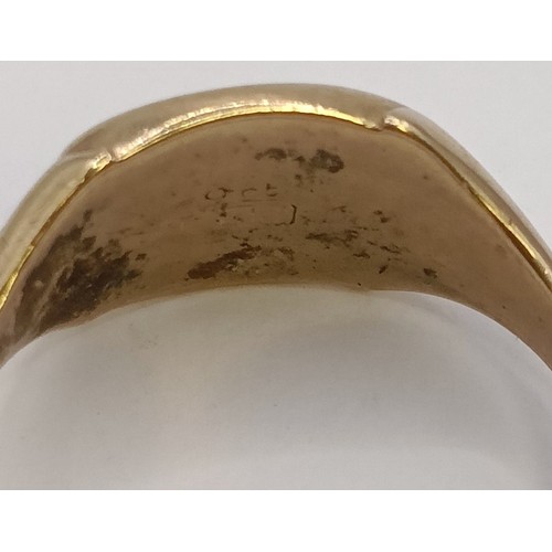 1704 - A yellow metal signet ring, ring size U