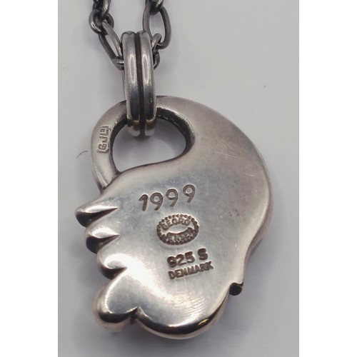 1724 - A George Jensen silver pendant, on a chain, 12.8 g