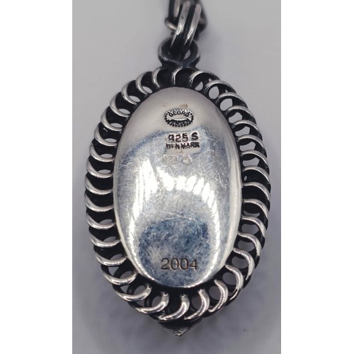 1725 - A Georg Jensen silver pendant, on a chain, 12.9 g