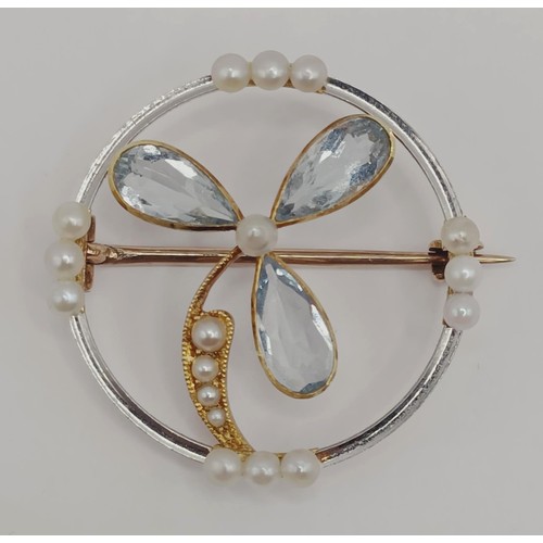 1731 - An aquamarine and seed pearl brooch, decorated a flower