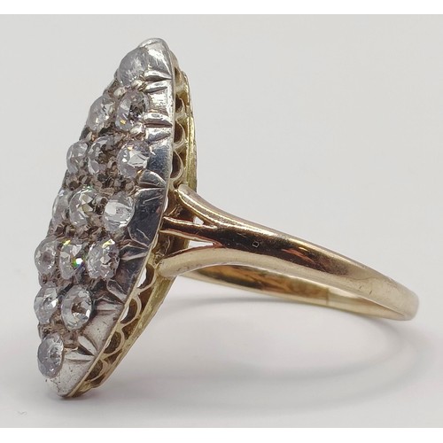 1736 - A marquis shaped diamond cluster ring, ring size O