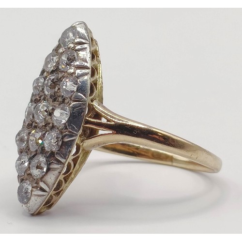 1736 - A marquis shaped diamond cluster ring, ring size O