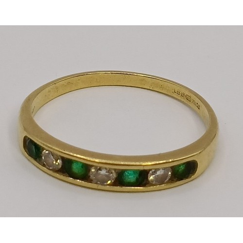 1747 - An 18ct gold, diamond and emerald half hoop ring, ring size M