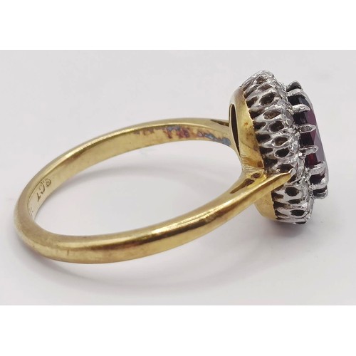 1751 - An 18ct gold, garnet and diamond ring, ring size L