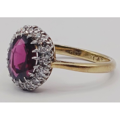 1751 - An 18ct gold, garnet and diamond ring, ring size L