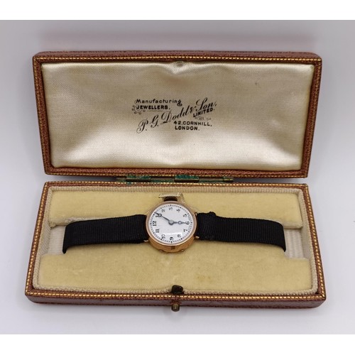 1756 - A 9ct gold ladies wristwatch, on a silk strap, in a vintage jewellery box and a dress ring in the fo... 