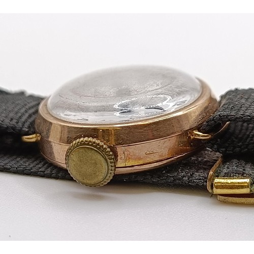 1756 - A 9ct gold ladies wristwatch, on a silk strap, in a vintage jewellery box and a dress ring in the fo... 