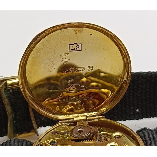 1756 - A 9ct gold ladies wristwatch, on a silk strap, in a vintage jewellery box and a dress ring in the fo... 