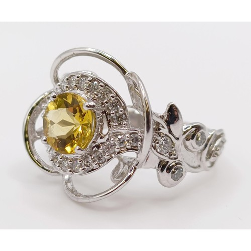 1774 - A white metal, diamond and yellow stone fancy ring, ring size M