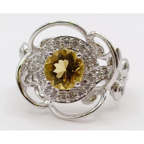 1774 - A white metal, diamond and yellow stone fancy ring, ring size M