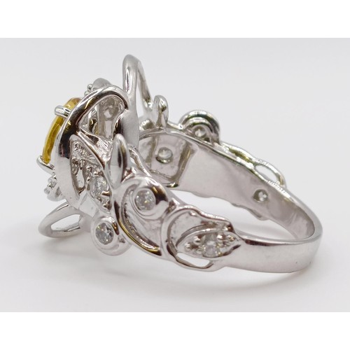 1774 - A white metal, diamond and yellow stone fancy ring, ring size M