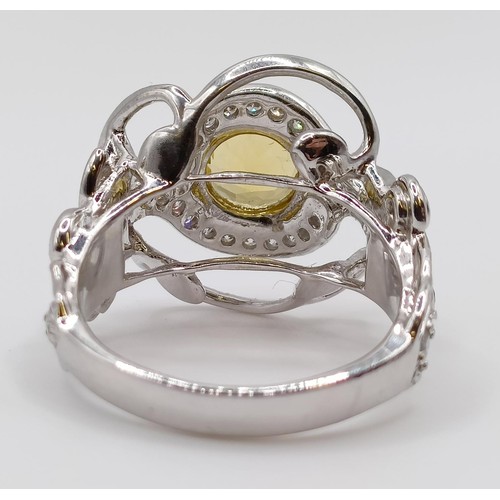 1774 - A white metal, diamond and yellow stone fancy ring, ring size M