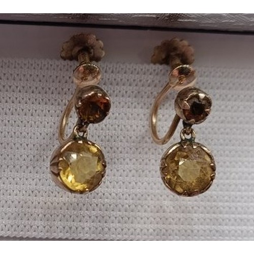 1778 - A pair of yellow metal and yellow stone earrings