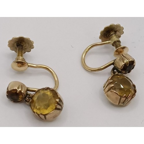 1778 - A pair of yellow metal and yellow stone earrings