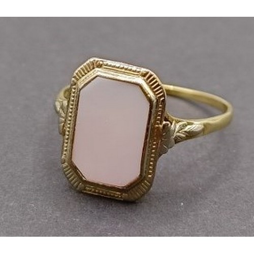 1779 - A 14ct gold panel ring, inset with a white stone, ring size T