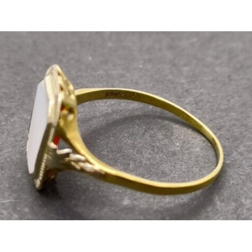 1779 - A 14ct gold panel ring, inset with a white stone, ring size T