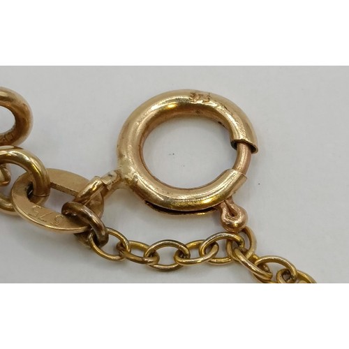 1781 - A 9ct gold chain, and assorted gold, yellow metal and silver charms