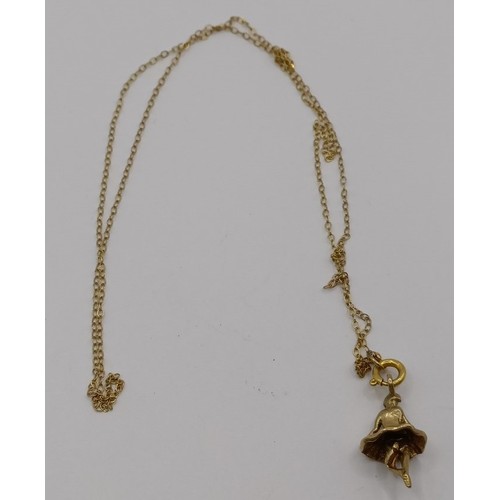 1781 - A 9ct gold chain, and assorted gold, yellow metal and silver charms